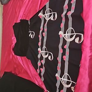 Never worn dress with hearts and musical notes.